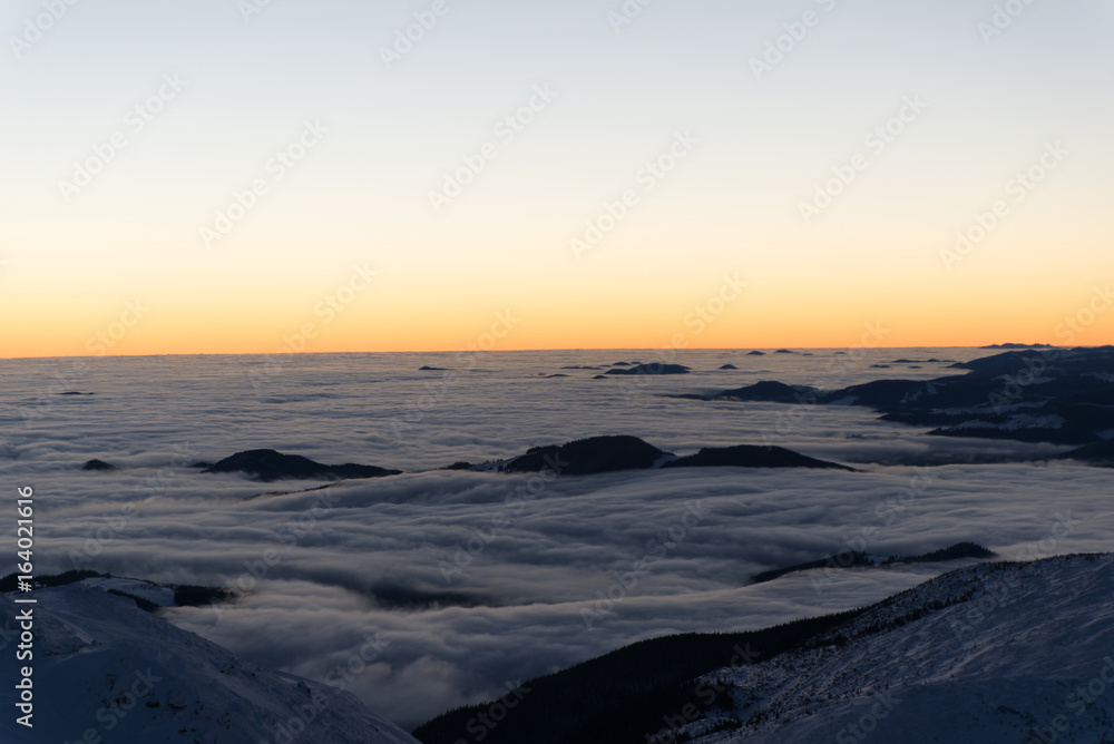 scenic sunrise, sunset in the winter mountains. mountain range