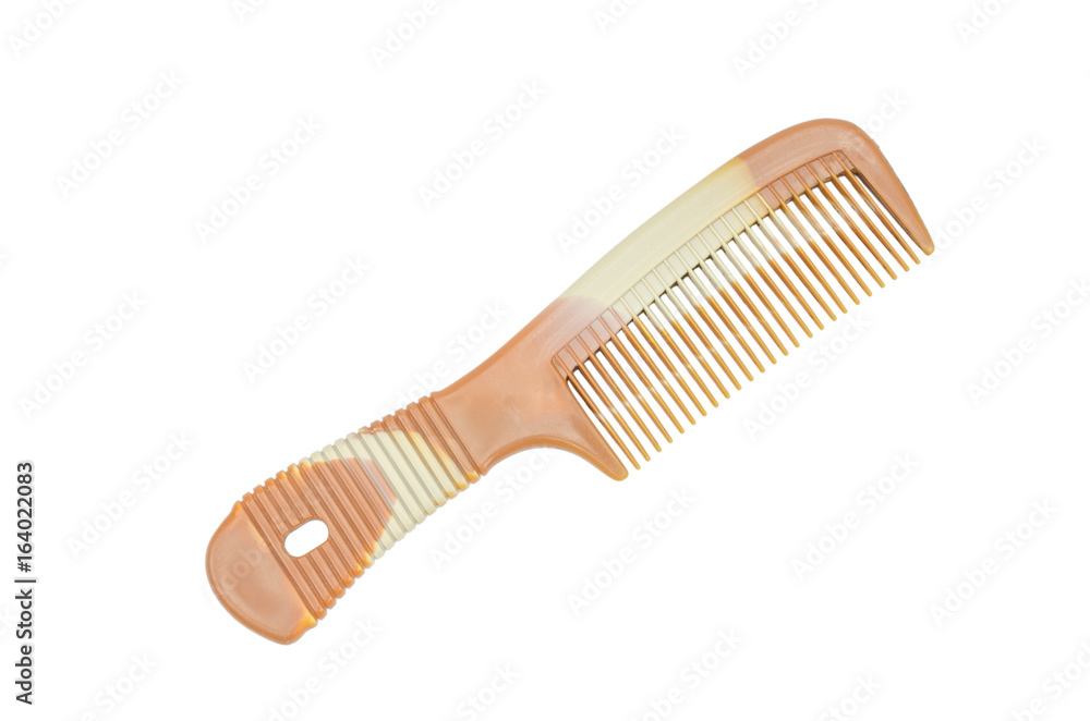 Brown plastic comb isolated on white background with clipping path Brown plastic comb isolated on white background with clipping path