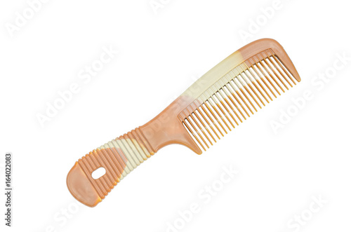 Brown plastic comb isolated on white background with clipping path