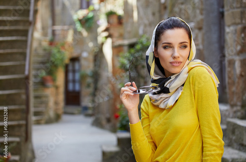 Tourists in a shawl on the streets of a small Italian town