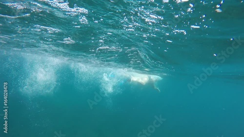 Wallpaper Mural swimmer in flippers swim into the sea, raw, 4K Torontodigital.ca