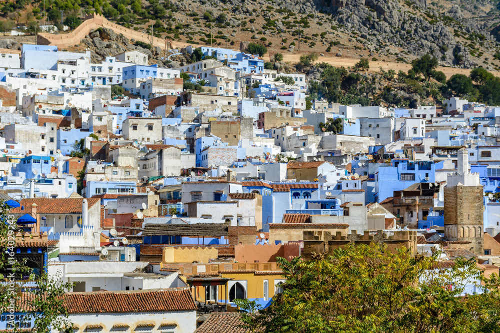 An overlook of Chefchaouen, Morocco with the fortress walls