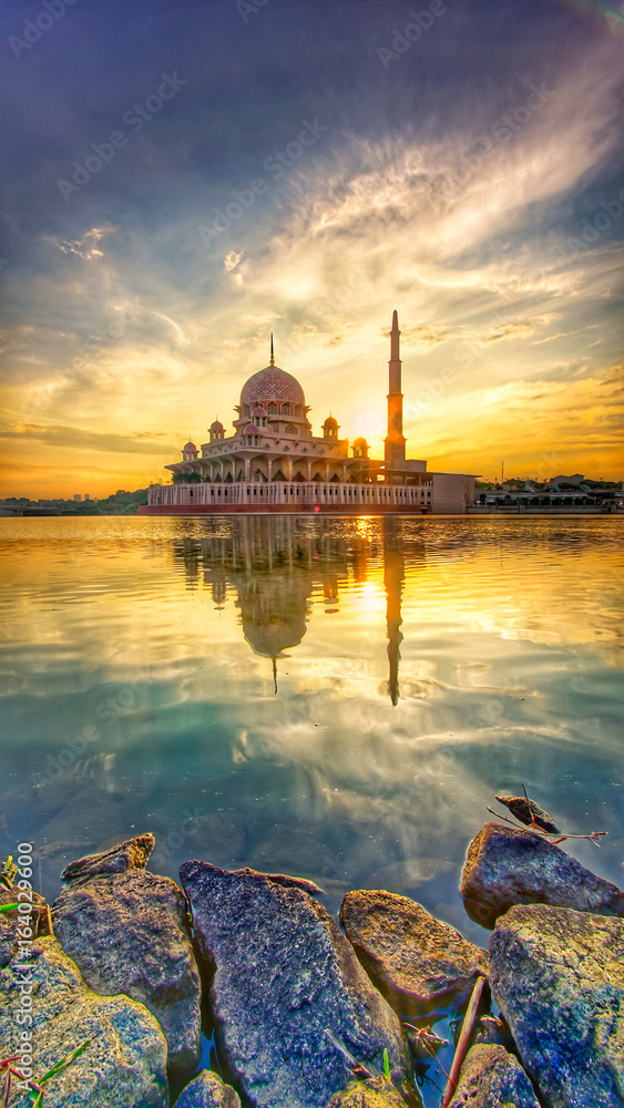 Glorious Sunrise view with reflection image on the lake of Masjid Putra, Putrajaya. 