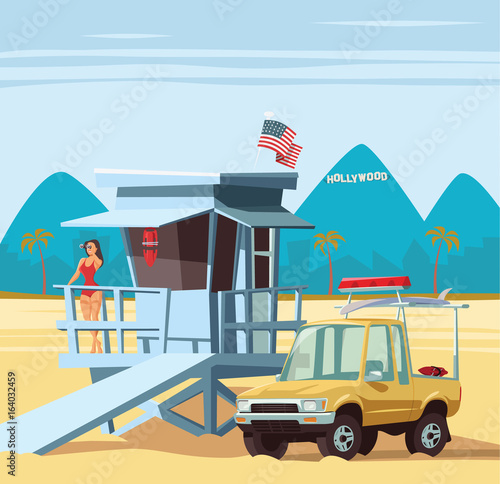Woman lifeguard on duty with truck in Los Angeles beach