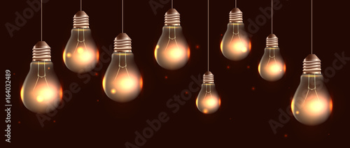 Illustration of hanging realistic light bulbs with light and sparkle. Vector pattern for your creativity