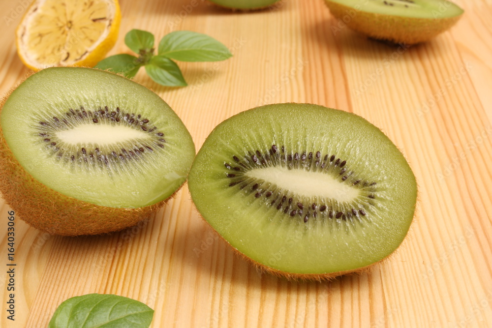Fototapeta premium Kiwi on a wooden background