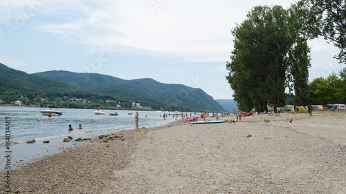 Fototapeta Naklejka Na Ścianę i Meble -  people enjoying summer on beach. life on beach in summer