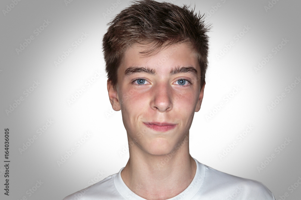 portrait of a smiling young man with gray background portrait of a smiling young man with gray background