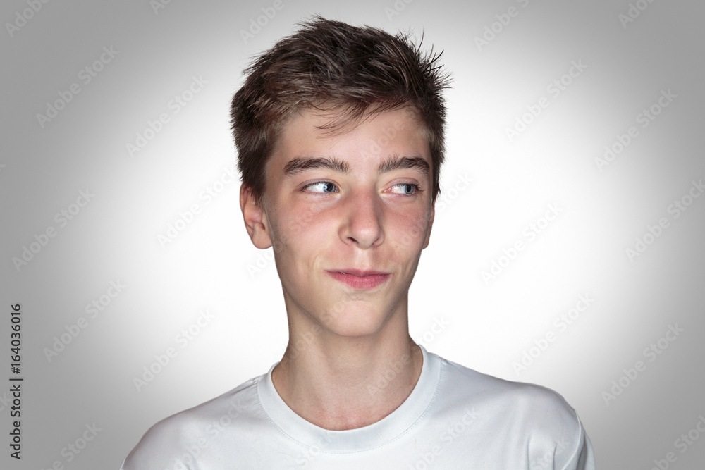 portrait of a smiling young man with gray background portrait of a smiling young man with gray background