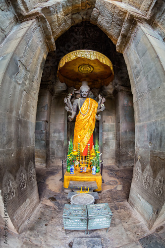Fisheye view of a decorated buddha figure at the main Angkor Wat temple complex in Siem Reap, Cambodia. photo
