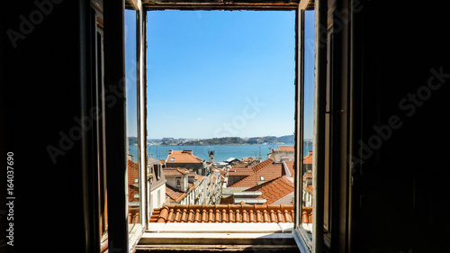 A view through the window: Lisbon's historical center and the river Tagus