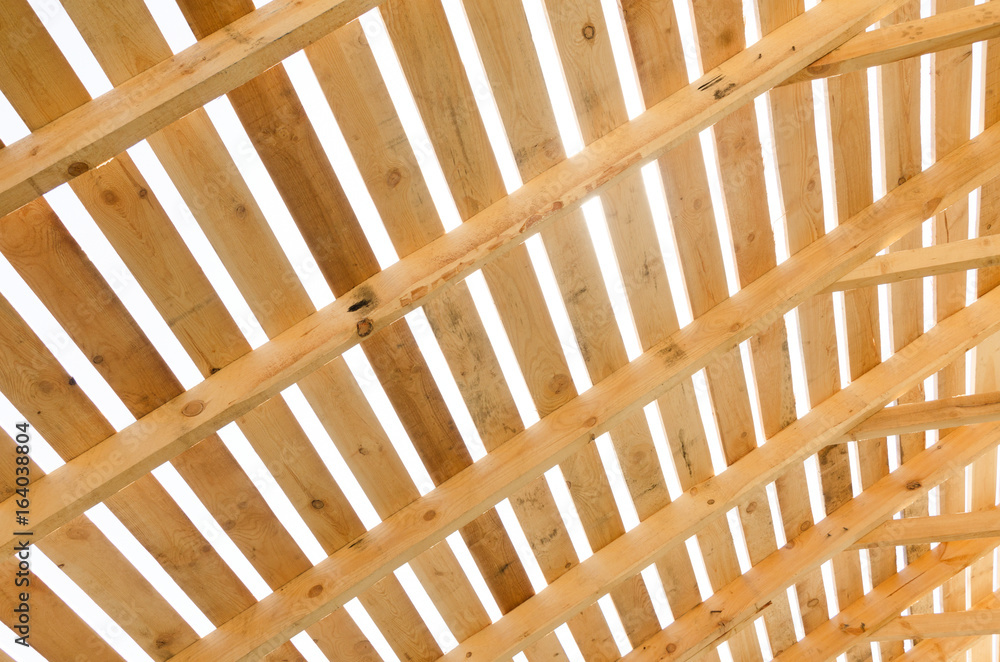 Wooden roof construction. Building in progress. House construction process. Wooden roof construction. Building in progress. House construction process.