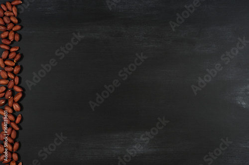 Peanuts on black chalkboard.