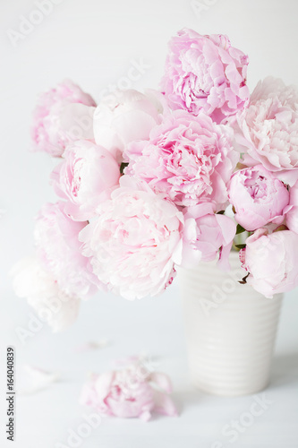 beautiful pink peony flowers bouquet in vase © Olga Miltsova
