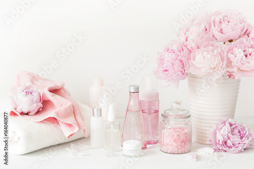 bath and spa with peony flowers beauty products towels