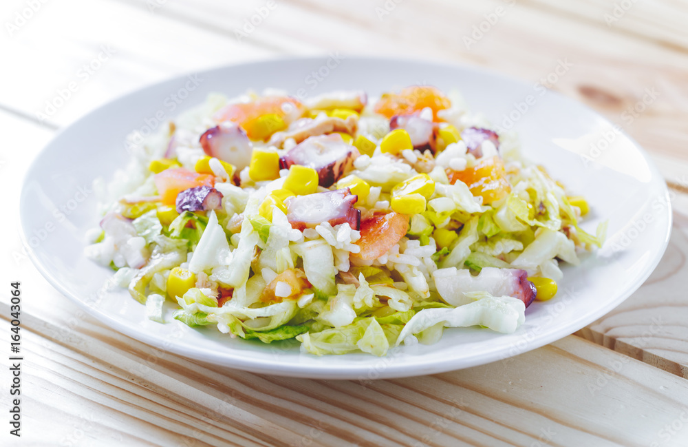 Cold summer salad with rice, coctopus, corn and vegetables. Concept of healthy food. Cold summer salad with rice, coctopus, corn and vegetables. Concept of healthy food.