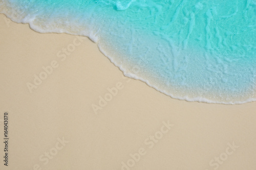 Fototapeta Naklejka Na Ścianę i Meble -  Soft waves of blue sea on the Maldives beach for the background.