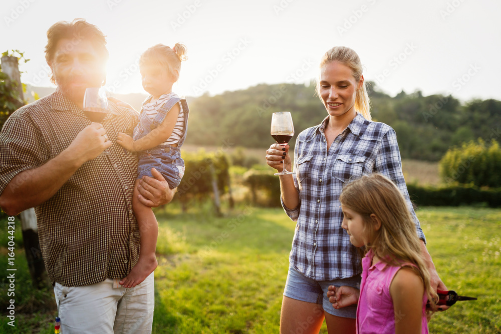Fototapeta premium Winemaker family together in vineyard