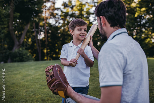 Dad with son playing baseball © Vasyl