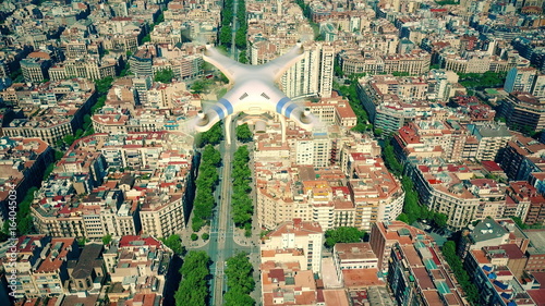 Photography Aerial view of drone flying and filming above Barcelona blocks pattern, Spain