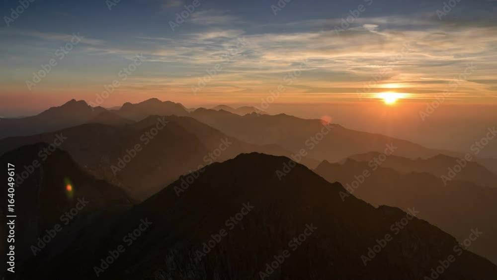 Stunning red sky at sunset in Fagaras Mountains. Panorama view of the ridge and the orange horizon. 4k timelapse. Stunning red sky at sunset in Fagaras Mountains. Panorama view of the ridge and the orange horizon. 4k timelapse.