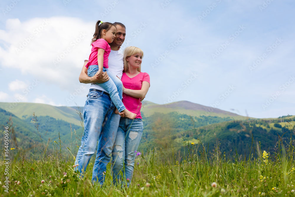 Happy family walking in the mountains. Family concept. Family trip. Happy family walking in the mountains. Family concept. Family trip.