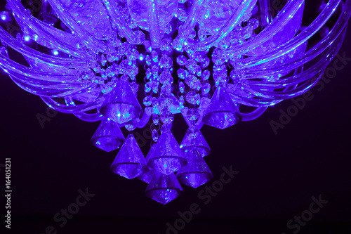 Beautiful glamour glass crystal chandelier closeup. Expensive classical luxury interior concept.