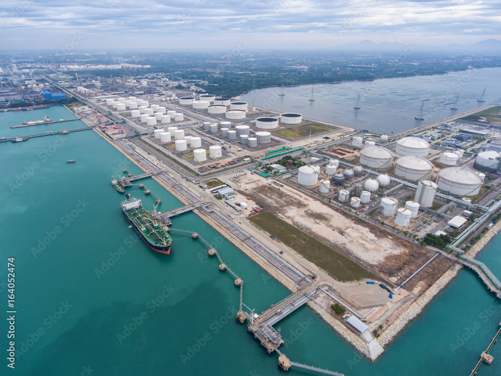 Oil refinery with a background of the sea and sky.The factory is located in the middle of nature and no emissions. The area around the air pure.business logistic.Aerial view .