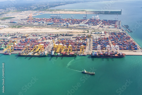 container,container ship in import export and business logistic.By crane ,Trade Port , Shipping.cargo to harbor.Aerial view.Water transport.International.Shell Marine.transportation.business,logistic.