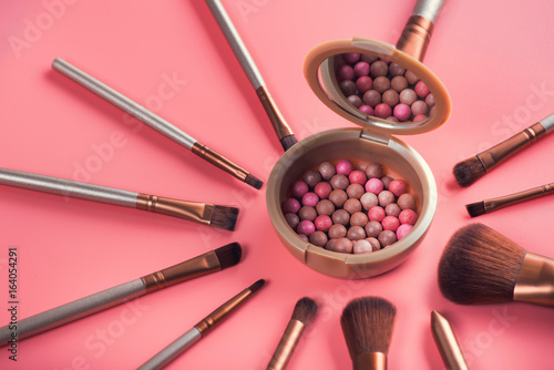 Powder balls and cosmetic brush