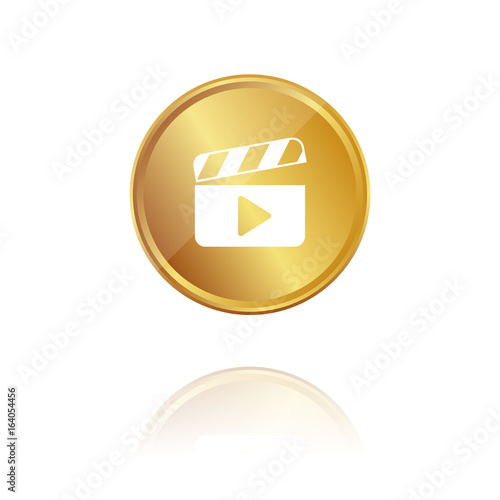 Filmklappe - Gold Münze mit Reflektion