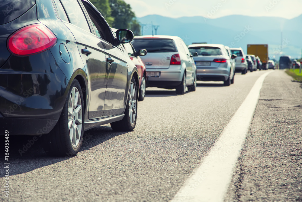 Traffic jam on the highway in the summer holiday period or in a traffic accident. Slow or bad traffic Traffic jam on the highway in the summer holiday period or in a traffic accident. Slow or bad traffic