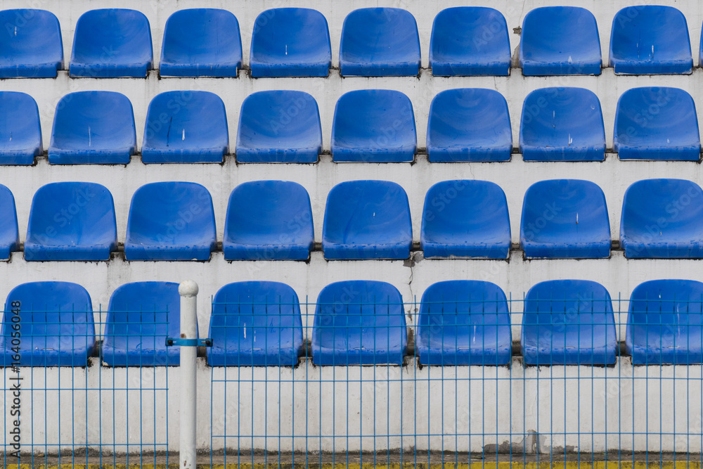 Naklejka premium blue rows of seats on the stadium