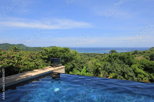 Infinity pool of a luxury house with view of the rainforest and beach, Costa Rica, Central America