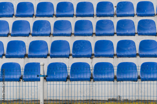 blue rows of seats on the stadium