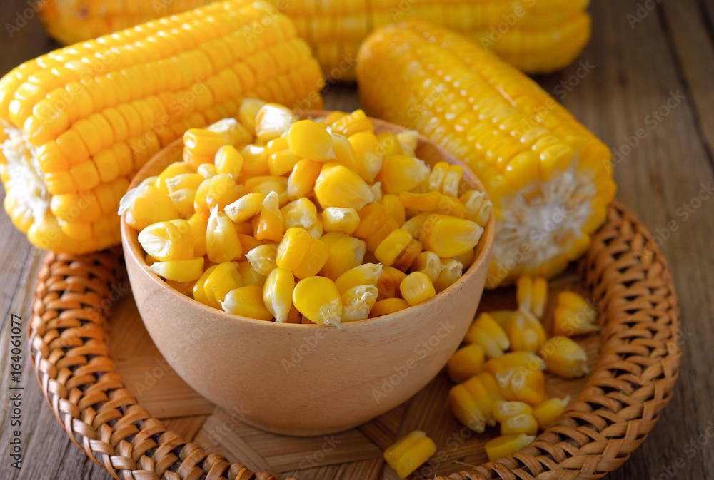 Grilled sweet corn on wooden background Grilled sweet corn on wooden background