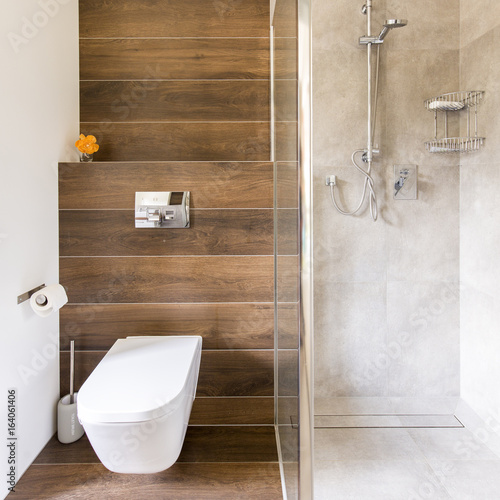 Bathroom with wood and travertine decor photo