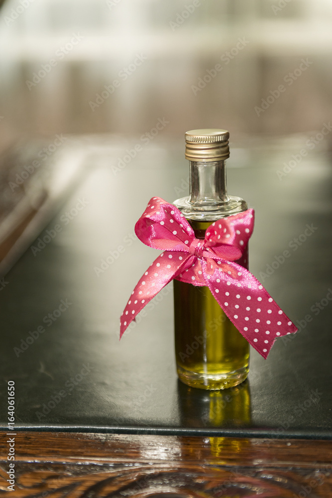 Lovely decorated chrism bottle at romanian Christening ceremony Stock