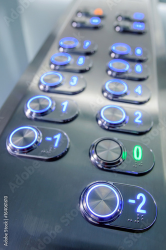 Elevator buttons inside elevator cabin pressing buttons