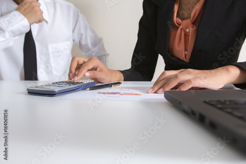 Two businessman check profit graph and analyzes a reports. Financial reports are set of documents prepared by an administrative team at the end of an accounting period. Concept business finance