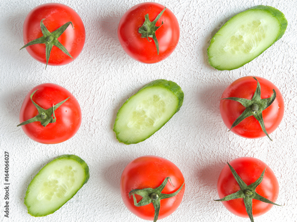Fresh juicy vegetables tomato pattern and light background with copy space Fresh juicy vegetables tomato pattern and light background with copy space
