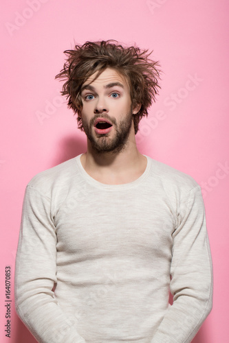 surprised man with long uncombed hair wake up in morning © Volodymyr