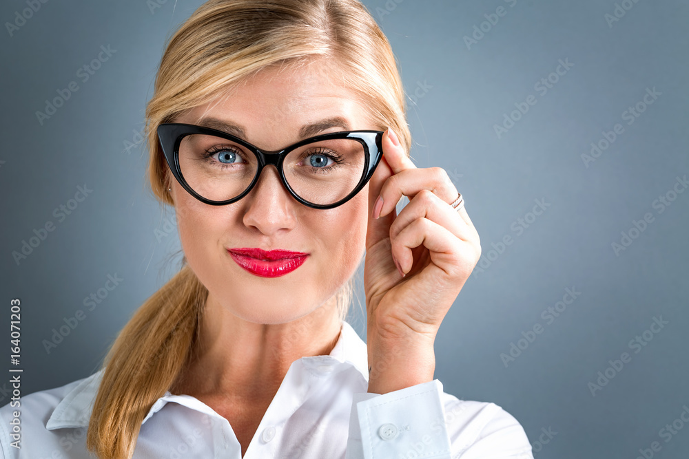 Happy young woman on a gray background Happy young woman on a gray background