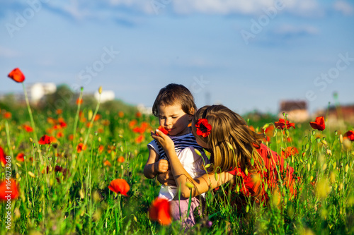 Girls in a poppy field © oksix