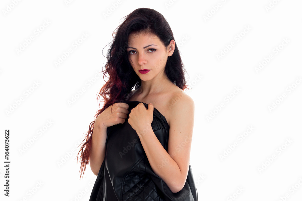 horizontal portrait of a beautiful brunette who looks into the camera, shielding her body jacket horizontal portrait of a beautiful brunette who looks into the camera, shielding her body jacket