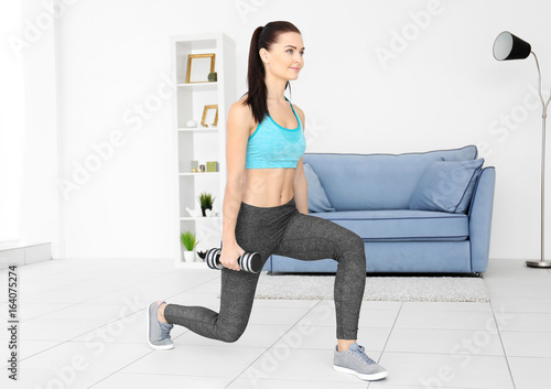 Attractive fitness woman ex...