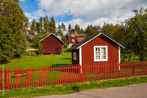 Typical scandinavian wooden houses in village. Dalarna county, Sweden.