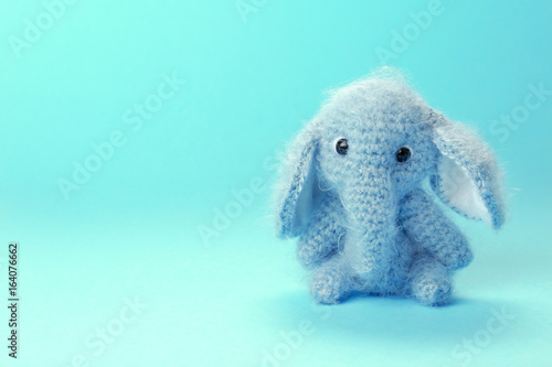 Adorable knitted baby eleph...