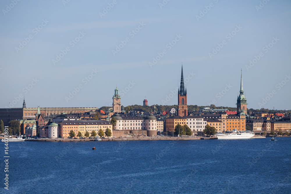 Obraz premium Scenic summer aerial view of old town, city hall and central embankments with boats. Stockholm, Sweden