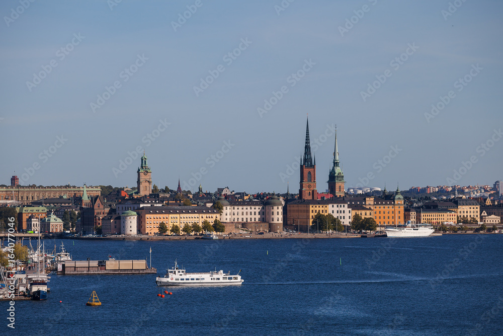 Scenic summer aerial view of old town, city hall and central embankments with boats. Stockholm, Sweden